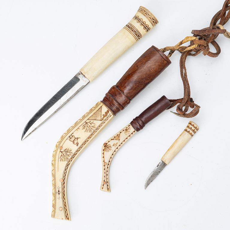 Half-horn knives, cup, bottle, needle case.