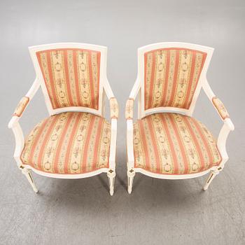 A pair of Swedish painted late Gustavian armchairs around 1800.