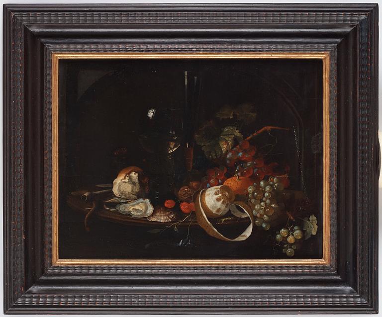 Willem Kalf In the manner of the artist, Still life with oysters, wine glass, clay pipe, fruits and insects.