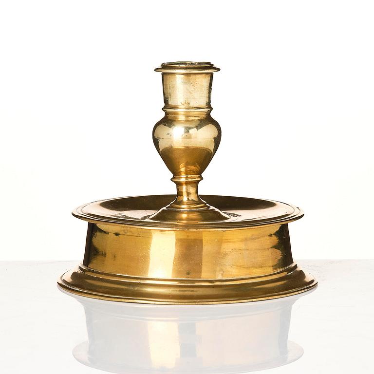 A Northern European baroque brass candlesticsk, late 17th century.