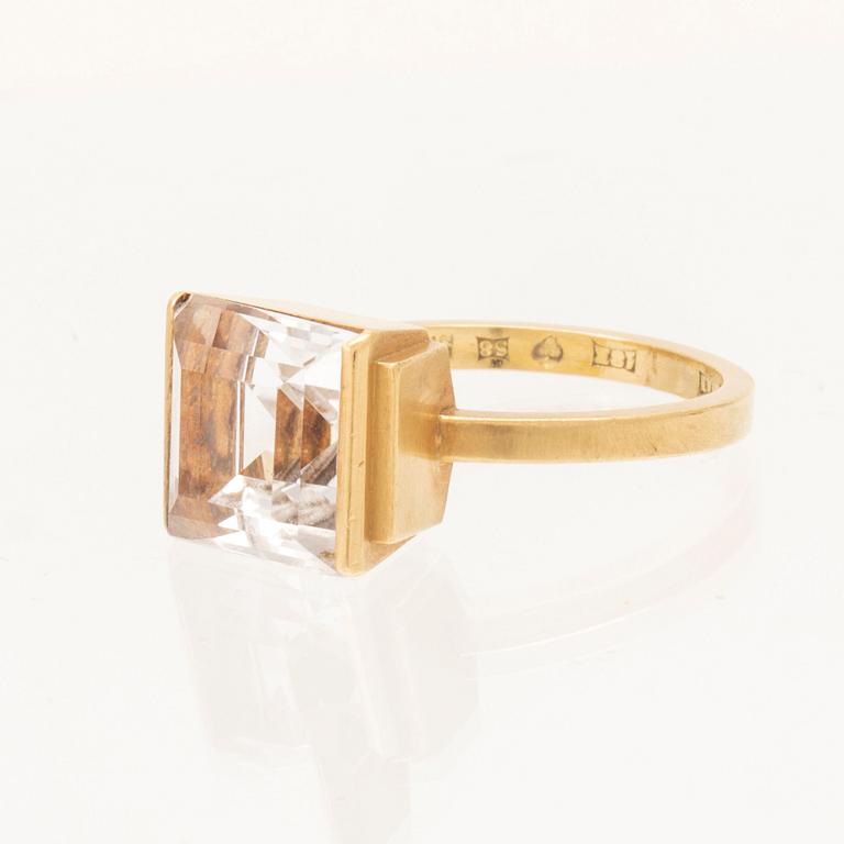 An 18K gold ring set with square step cut topaz by Wiwen Nilsson 1944.