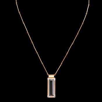 An 18K gold necklace set with a step cut rock crystal quartz by Ateljé Stigbert 1943.