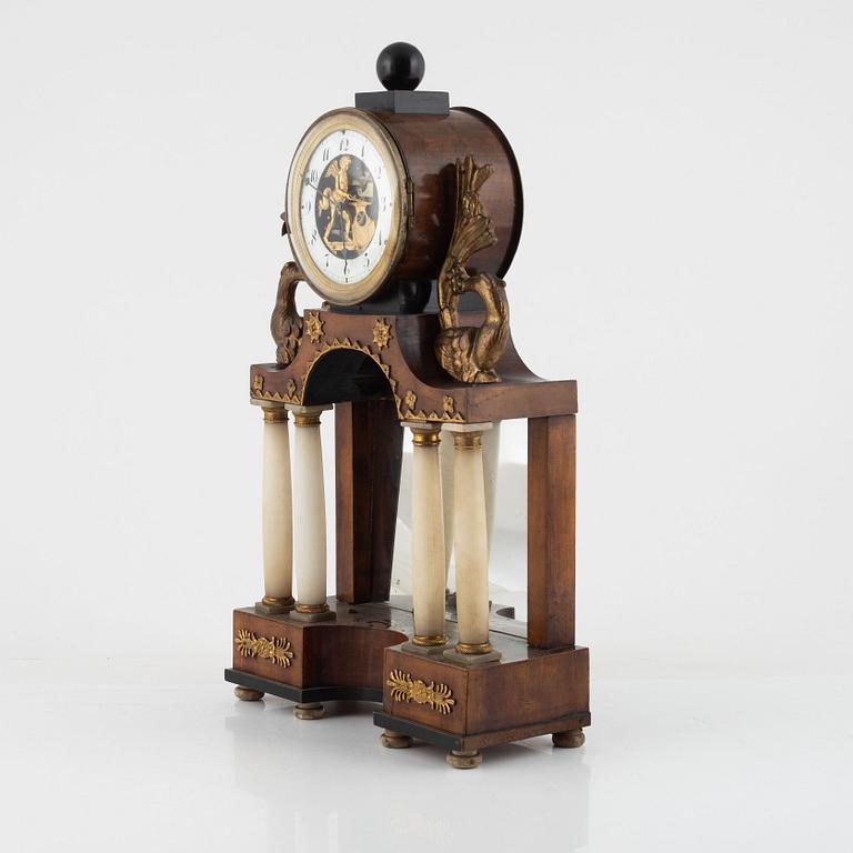 A presumably Austrian mahogany, gilt-brass, and alabaster portico mantel clock, early 19th century.