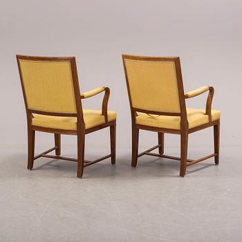 A pair of mahogny veneered armchairs from Nordiska Kompaniet (NK), 1920s.