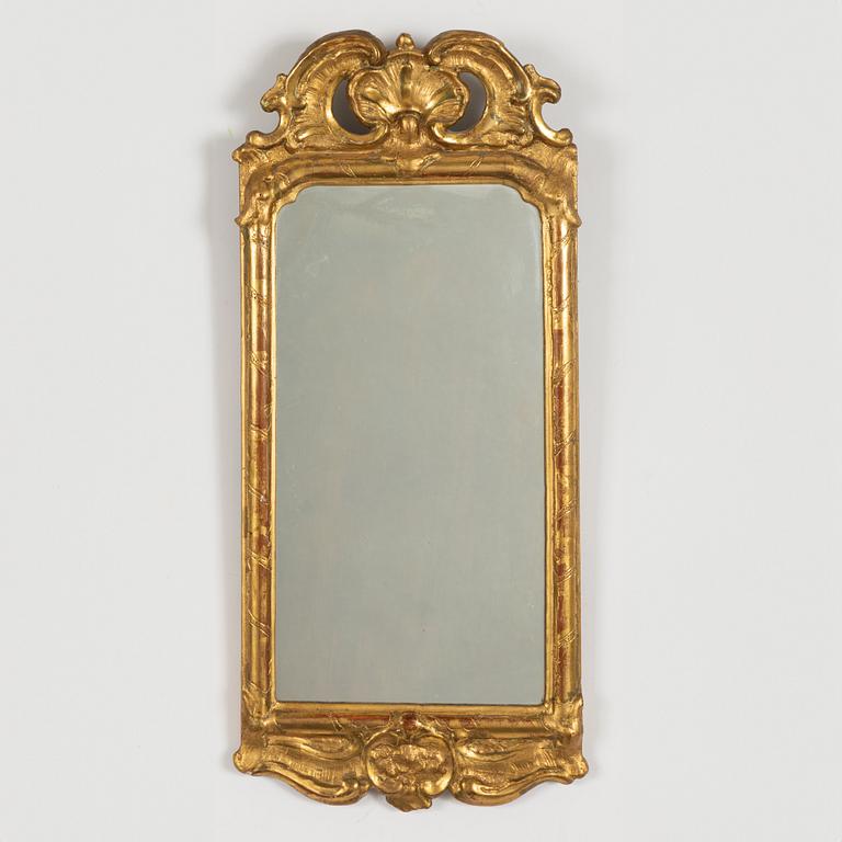 A rococo mirror, mid 18th century.