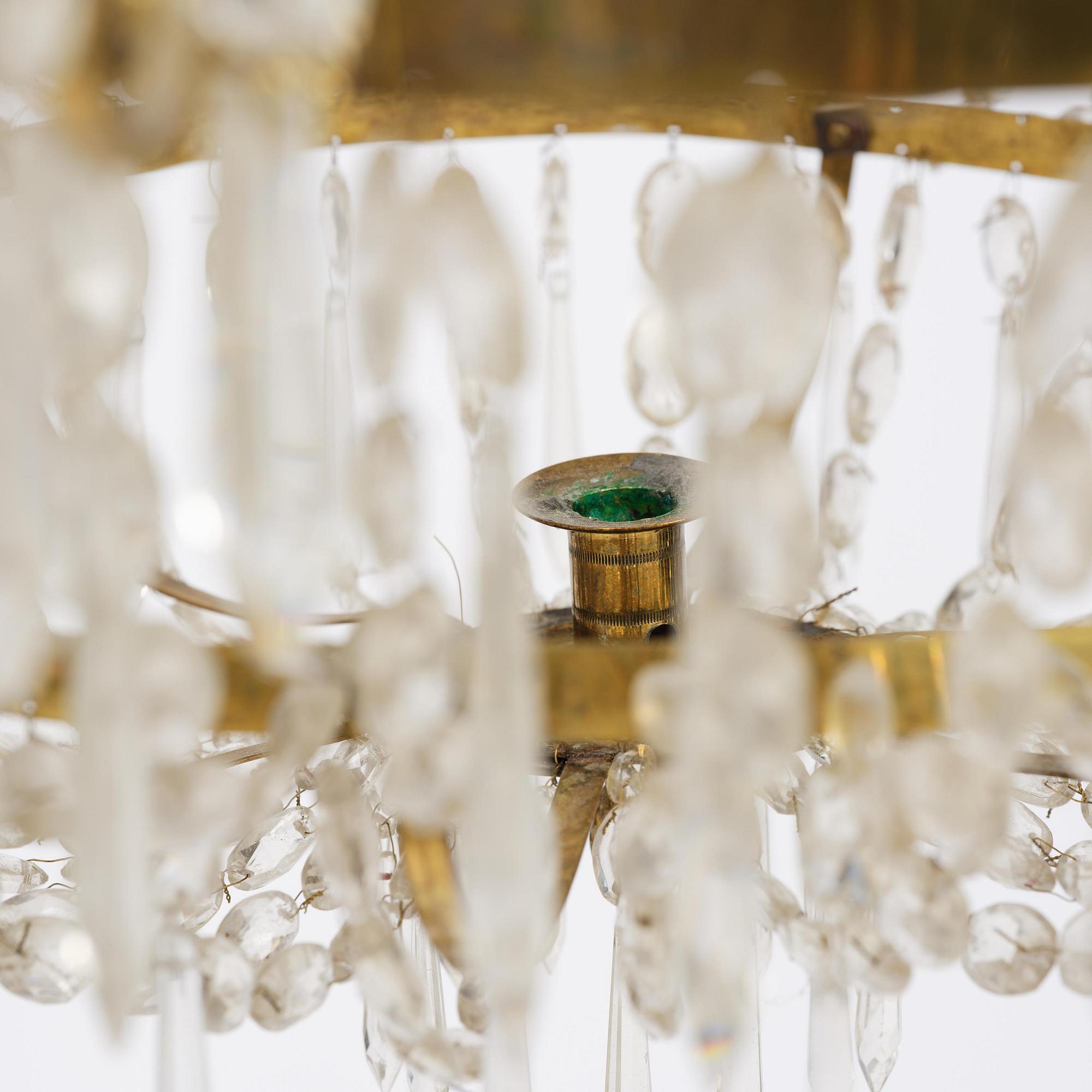 A Swedish gilt brass and cut glass thirteen-light Empire chandelier, early 19th century.