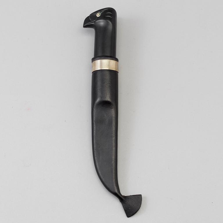 A Finnish puukko knife in leather sheath, for Fiskars, late 20th century.