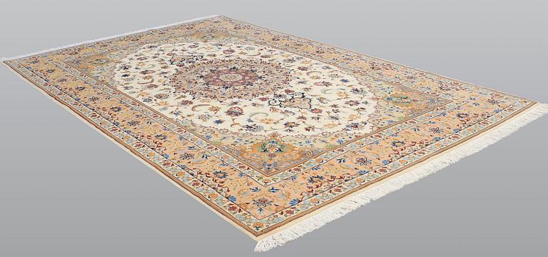 A carpet, Tabriz, ca 385 x 247 cm.