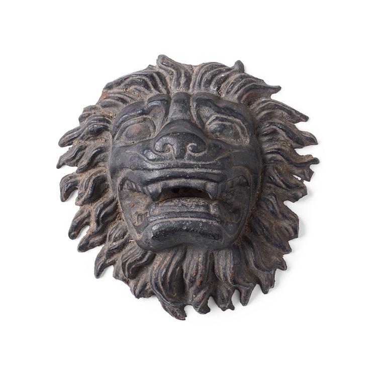 Anna Petrus, a cast iron mascaron in the shape of a lion's head.