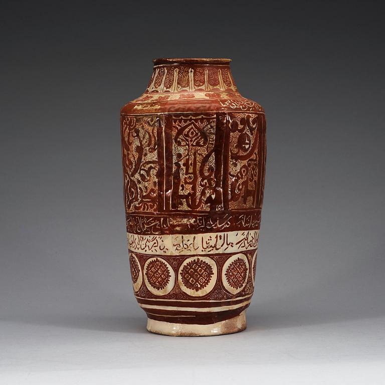 A JAR, lustre-decorated pottery. Height 32 cm. Central Persia (Iran) 12-13th century. Kashan style.