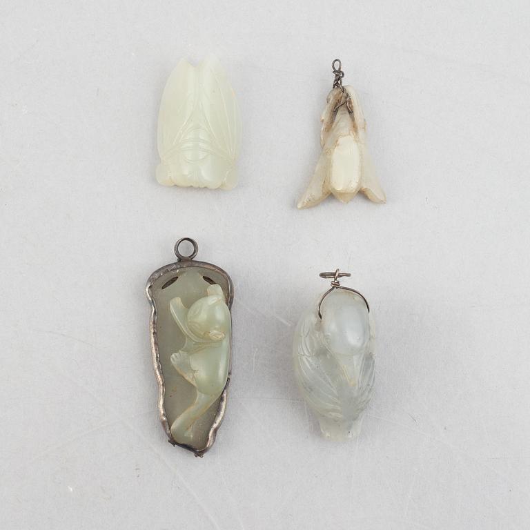 A group of eight Chinese stone charms / pendants, 20th century.