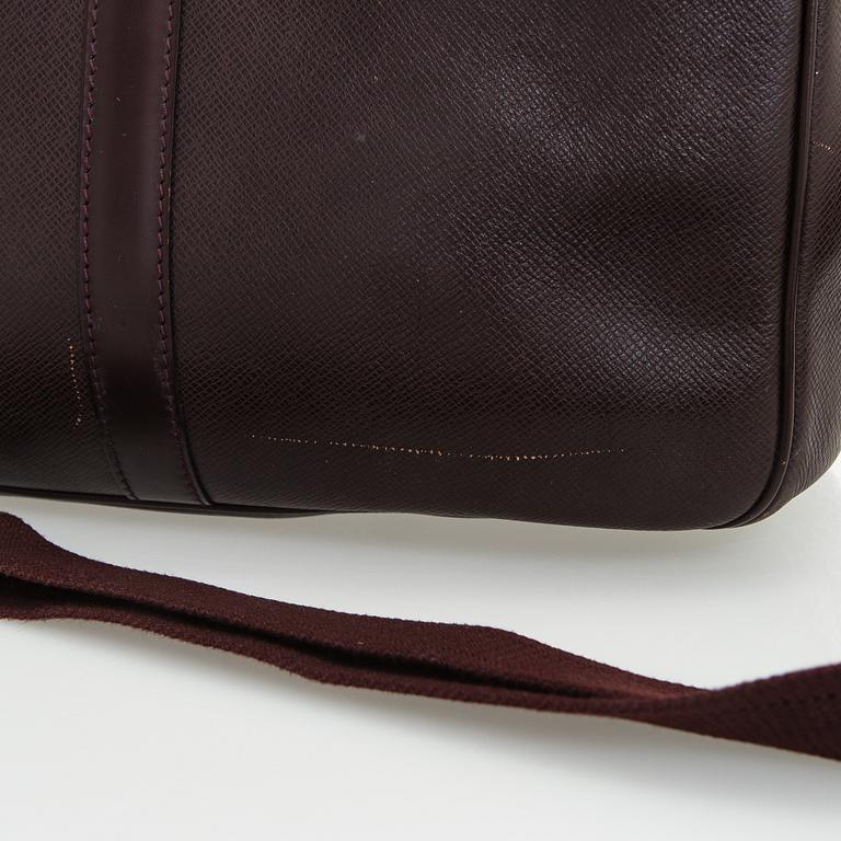 Louis Vuitton, a 'Taiga Kendall PM' weekend bag.
