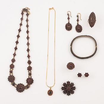 Garniture, two rings, brooch, two necklaces, and two pairs of earrings, armlet, garnets.