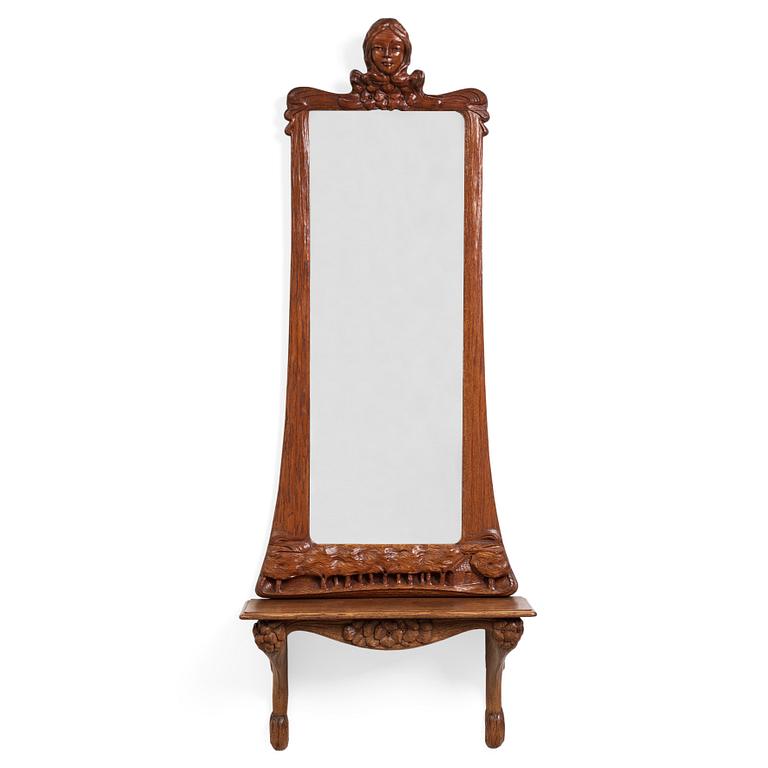 An Art Nouveau oak wall mirror with a console table.