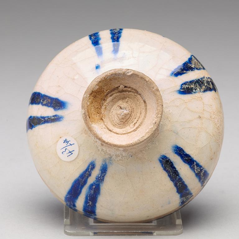 A BOWL, pottery with a white slip and underglaze blue decor, diameter ca 10 cm, Kashan, Persia/Iran early 13th century.