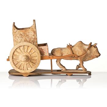 A pottery model of an ox with cart, Tang dynasty (618-907).