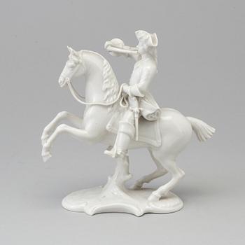 A white glazed Nymphenburg porcelain figure of a huntsman, Germany 20th Century.