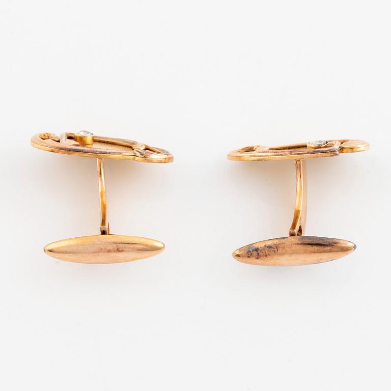 A pair of 14K gold cufflinks set with old-cut diamonds.