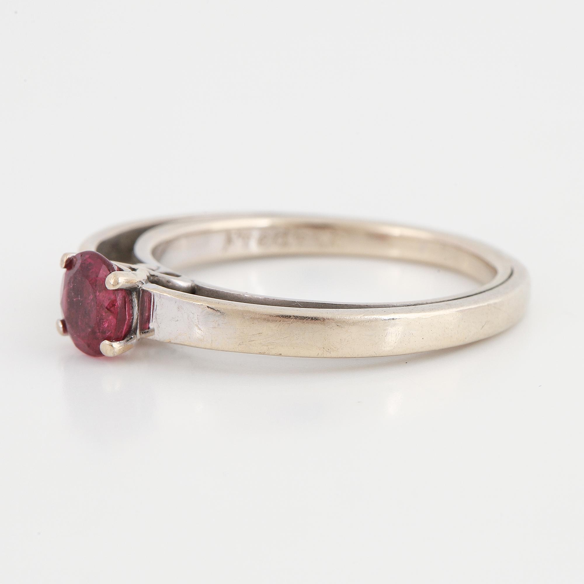 A tourmaline and brilliant cut diamond ring.