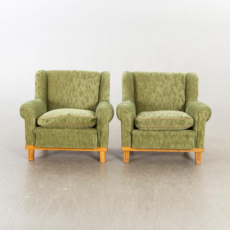 A pair of Swedish Modern lounge chairs.