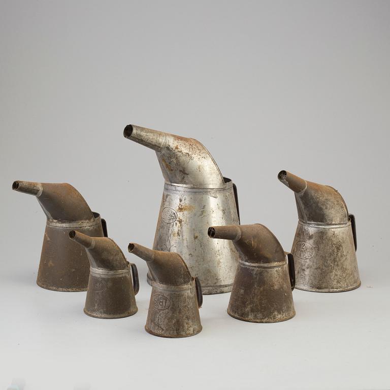 Six tin oil jugs, first half of the 20th Century.