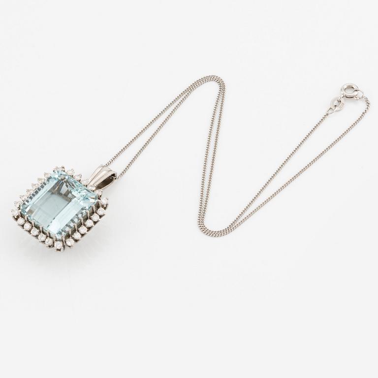 An 18K white gold Engelbert pendant set with a aquamarine and round brilliant-cut diamonds.