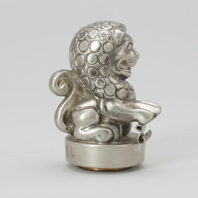 An Anna Petrus pewter and brass seal by Svenskt Tenn 1981.
