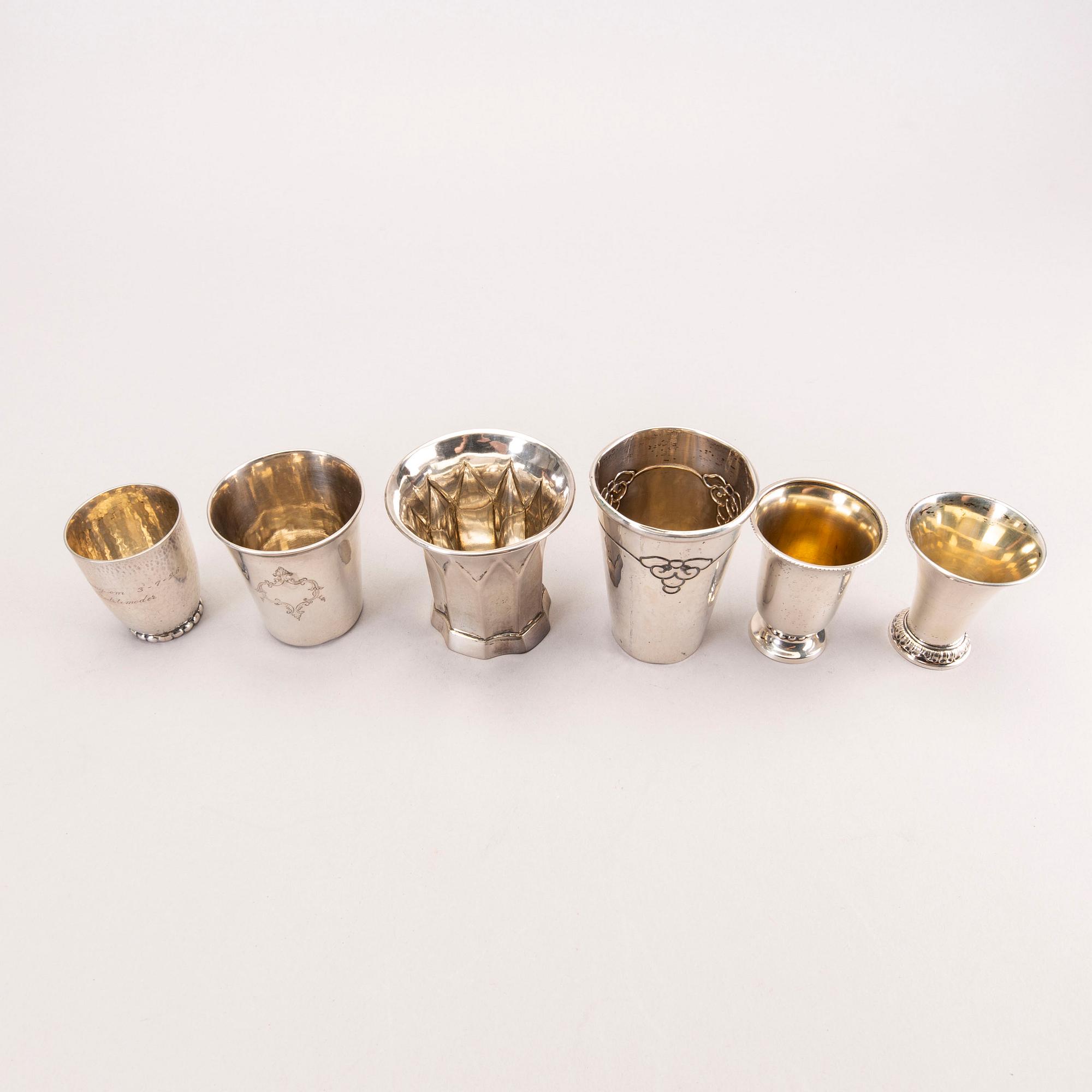 Six 20th century, miniature beakers, silver, makers of Georg Jensen, Lachmann and others.