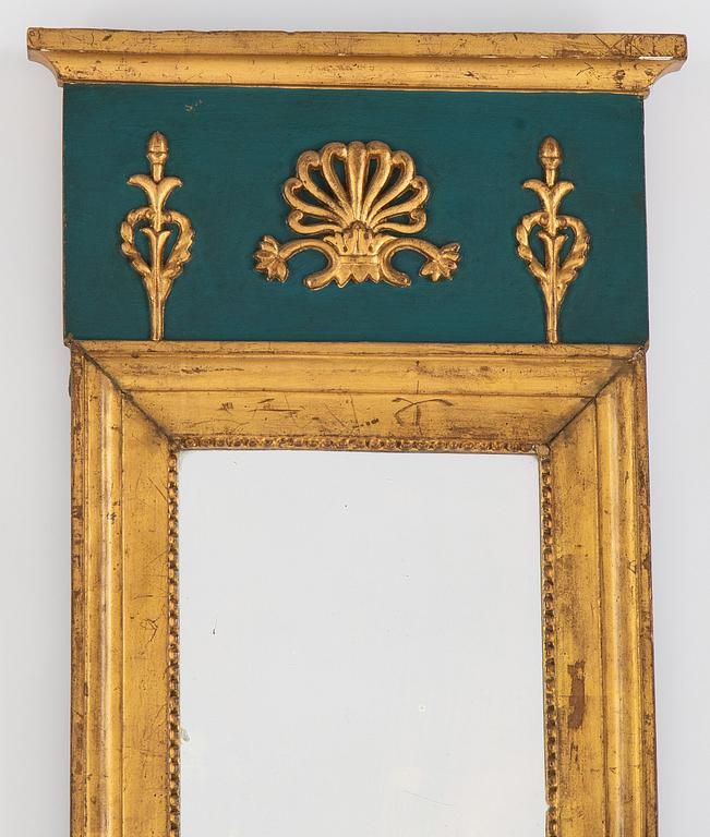 An Empire mirror, first half of the 19th century.