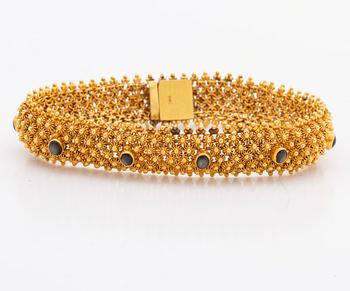 ARMBAND 14K guld, 35,1 g. bruna cabochonslipade stenar, ca 19 x 1,5 cm.