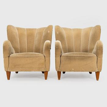 A pair of mid-20th century armchairs.