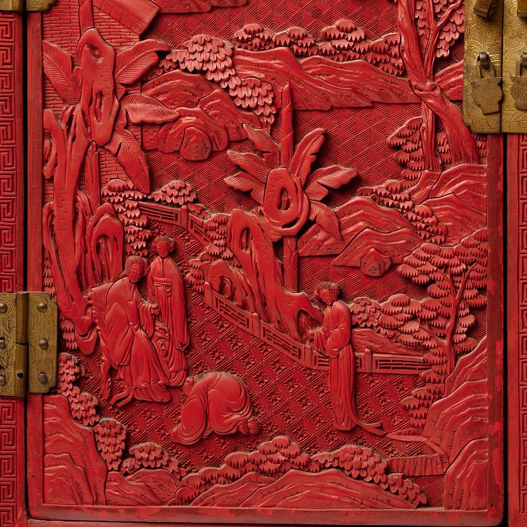 A carved  lacquer 'Kang'Cabinet, Qing dynasty, 18/19th Century.