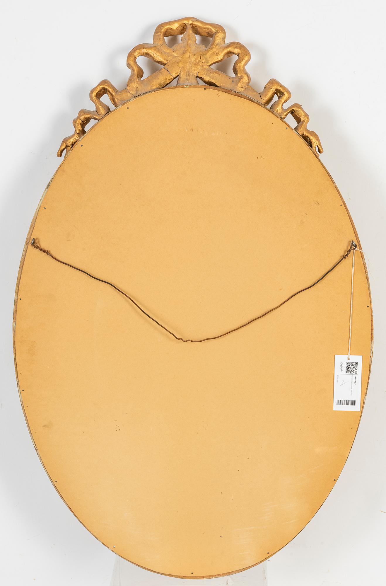 An oval Gustavian style mirror, early 20th Century.