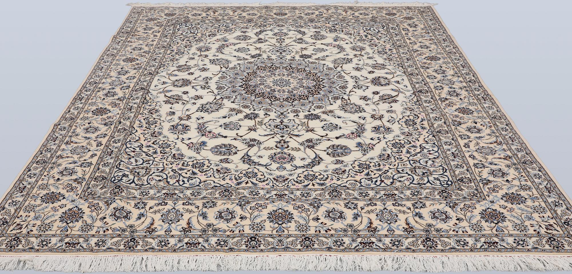 A Nain part silk carpet, 269 x 213 cm.