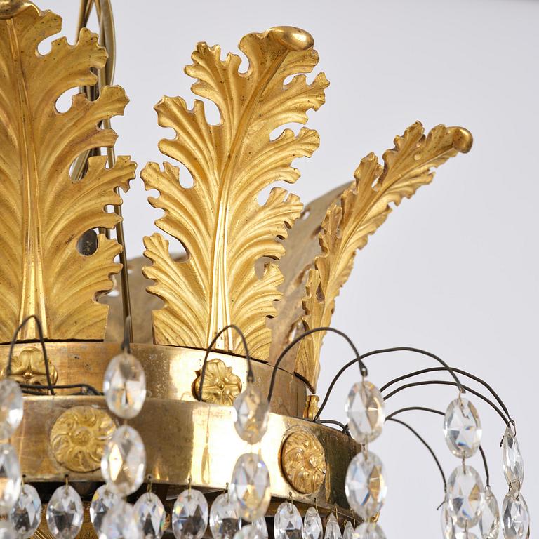 An ormolu and cut glass sixteen-branch Empire chandelier, Paris, early 19th century.