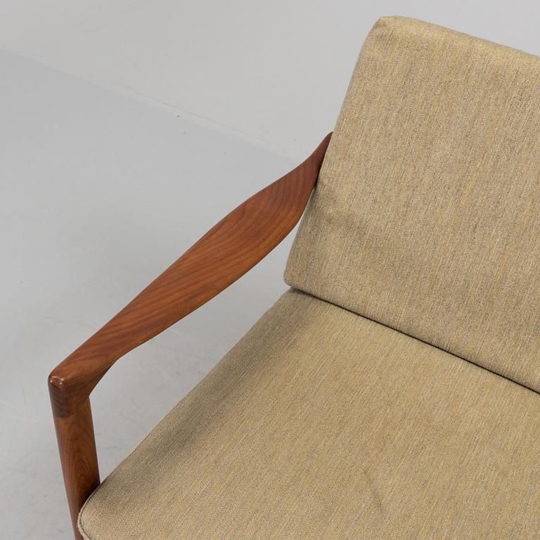 a 1960s teak "Kandidaten" armchair designed by IB Kofod Larsen for OPE Möbler, Jönköping.