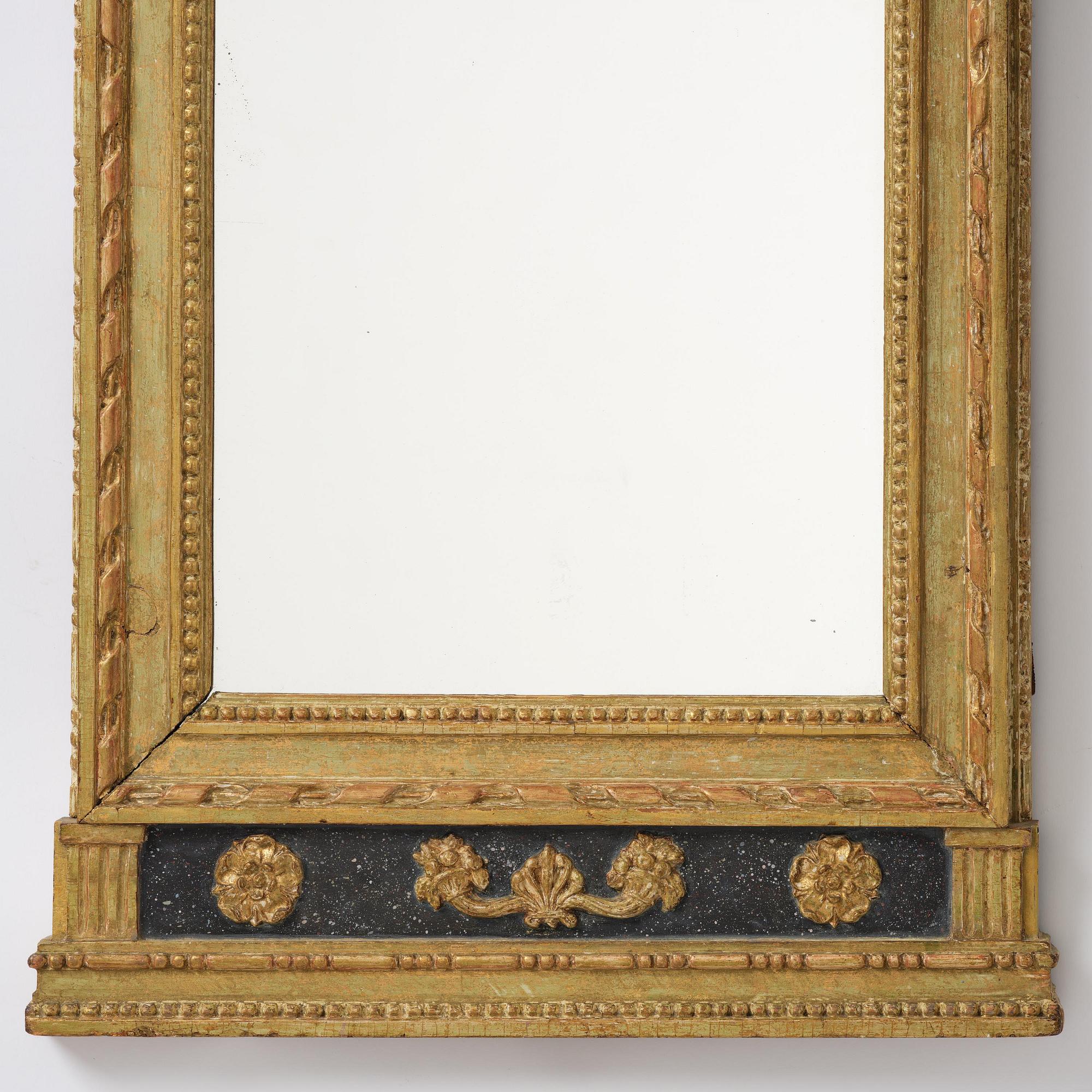 A late Gustavian giltwood mirror by E. Wahlberg (master in Stockholm ca 1760-1811).
