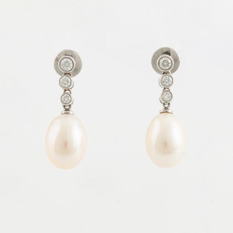 18K white gold, cultured pearl and brilliant cut diamond earrings.