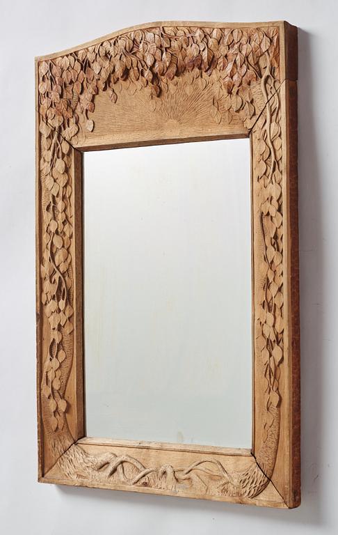 A Swedish Art Nouveau/ Folk art carved mirror, early 20th century.