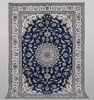 A carpet, Nain, part silk, c. 294 x 198 cm.