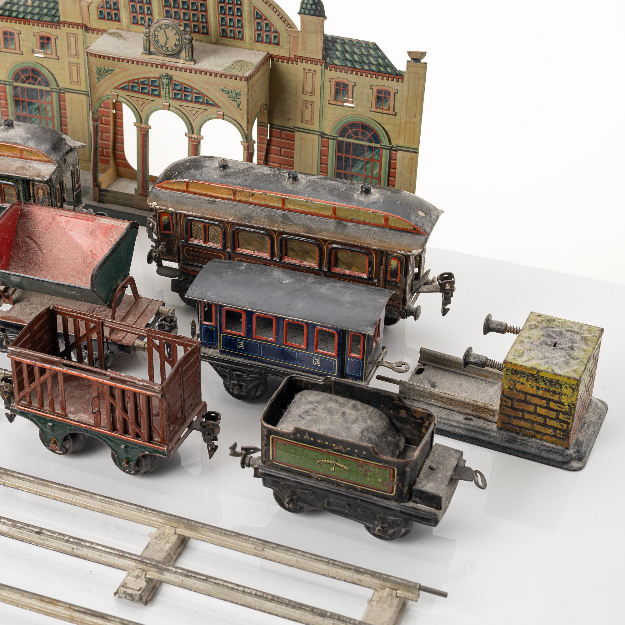 Model train with track and station building, 13 pieces, Germany, 1920s.