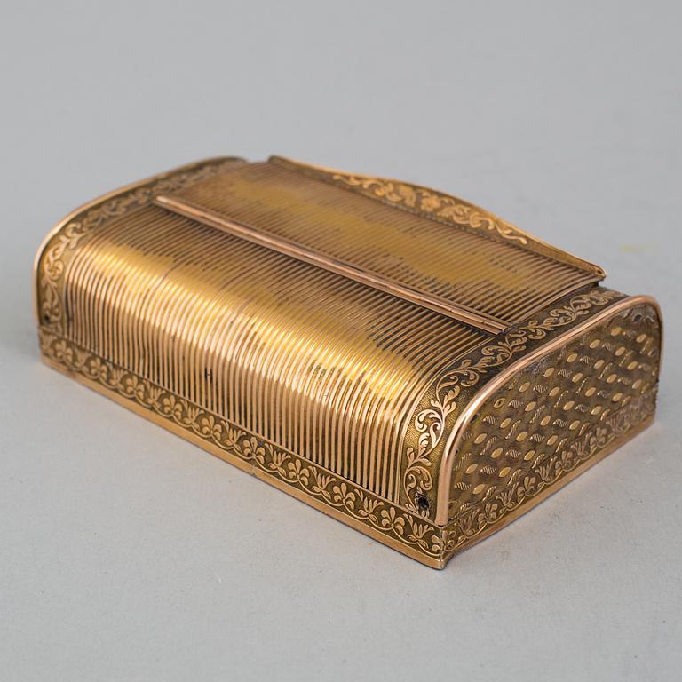 A brass music box, about 1900.