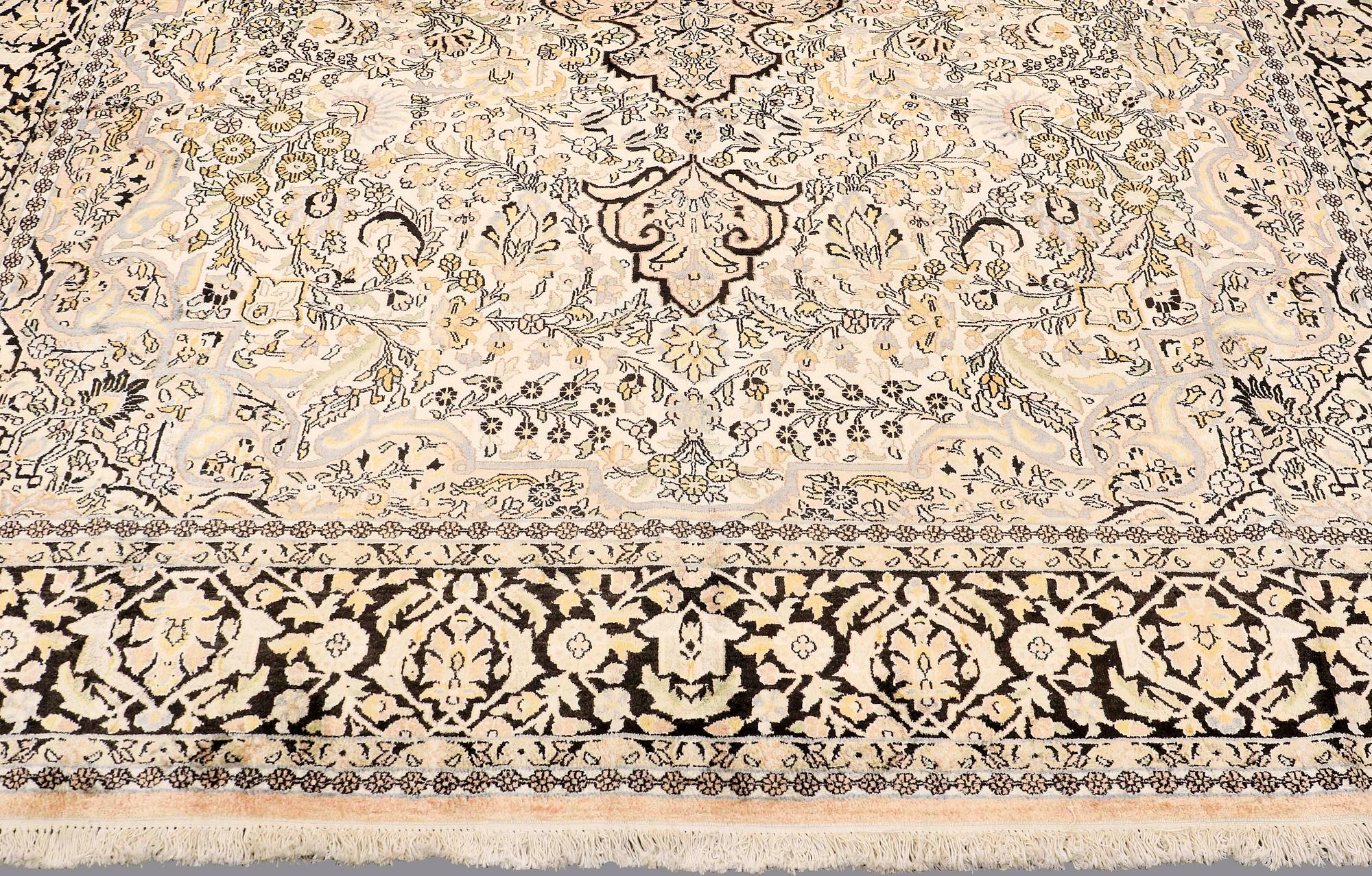 A CARPET, old silk Kashmir, ca 380 x 274 cm.