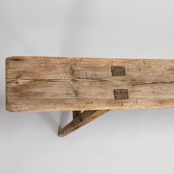 A folk art bench, circa 1900.