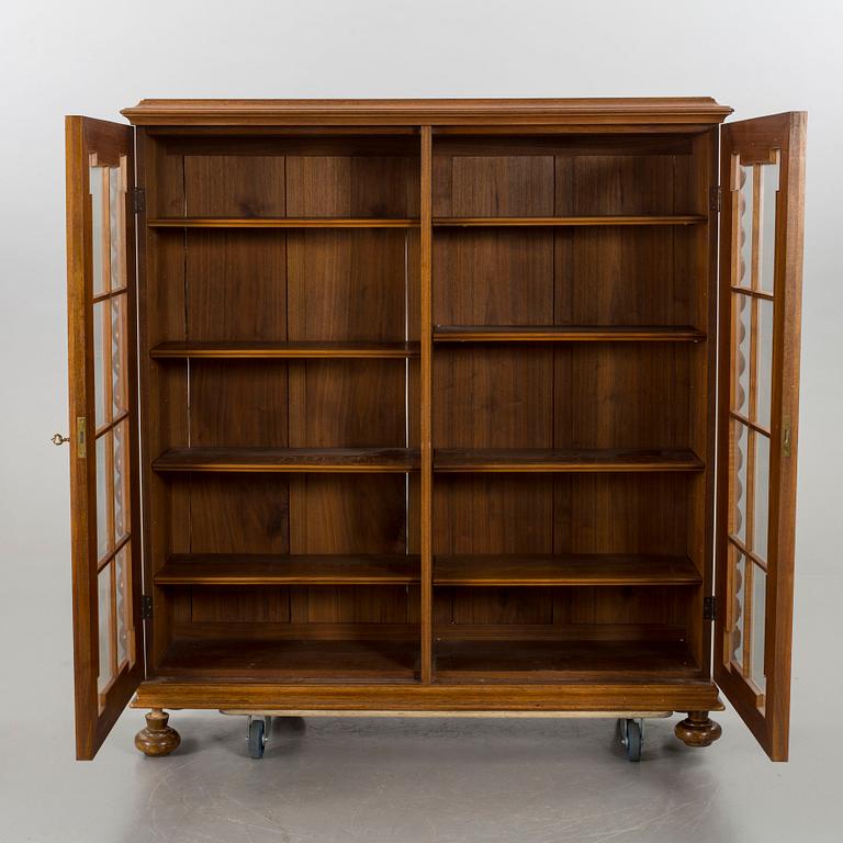 A BAROQUE STYLE BOOK SHELF.