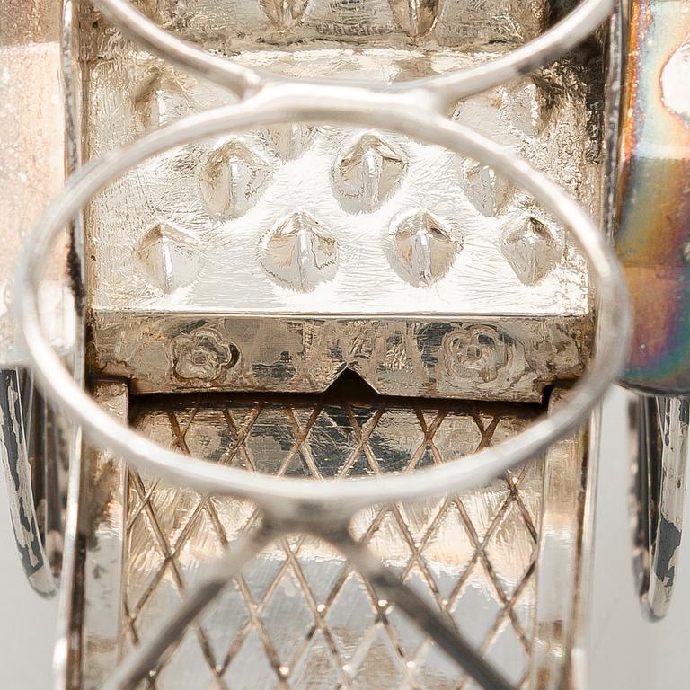 Four shakers in a pair of miniature rickshaws, sterling silver, maker's mark of Wai Kee, Hong Kong.