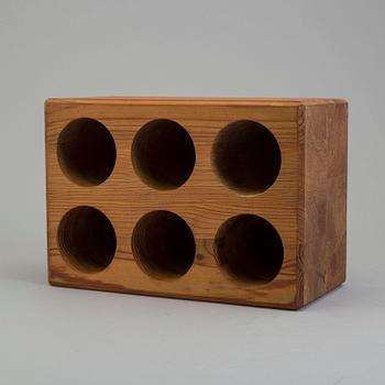 a 1960's/1970's pinewood wine rack, designed by Sven Larsson.