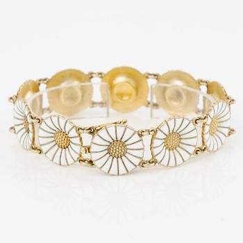Georg Jensen and A Michelsen "Daisy" a bracelet, a pendant, and a brooch silver gilt and enamel.