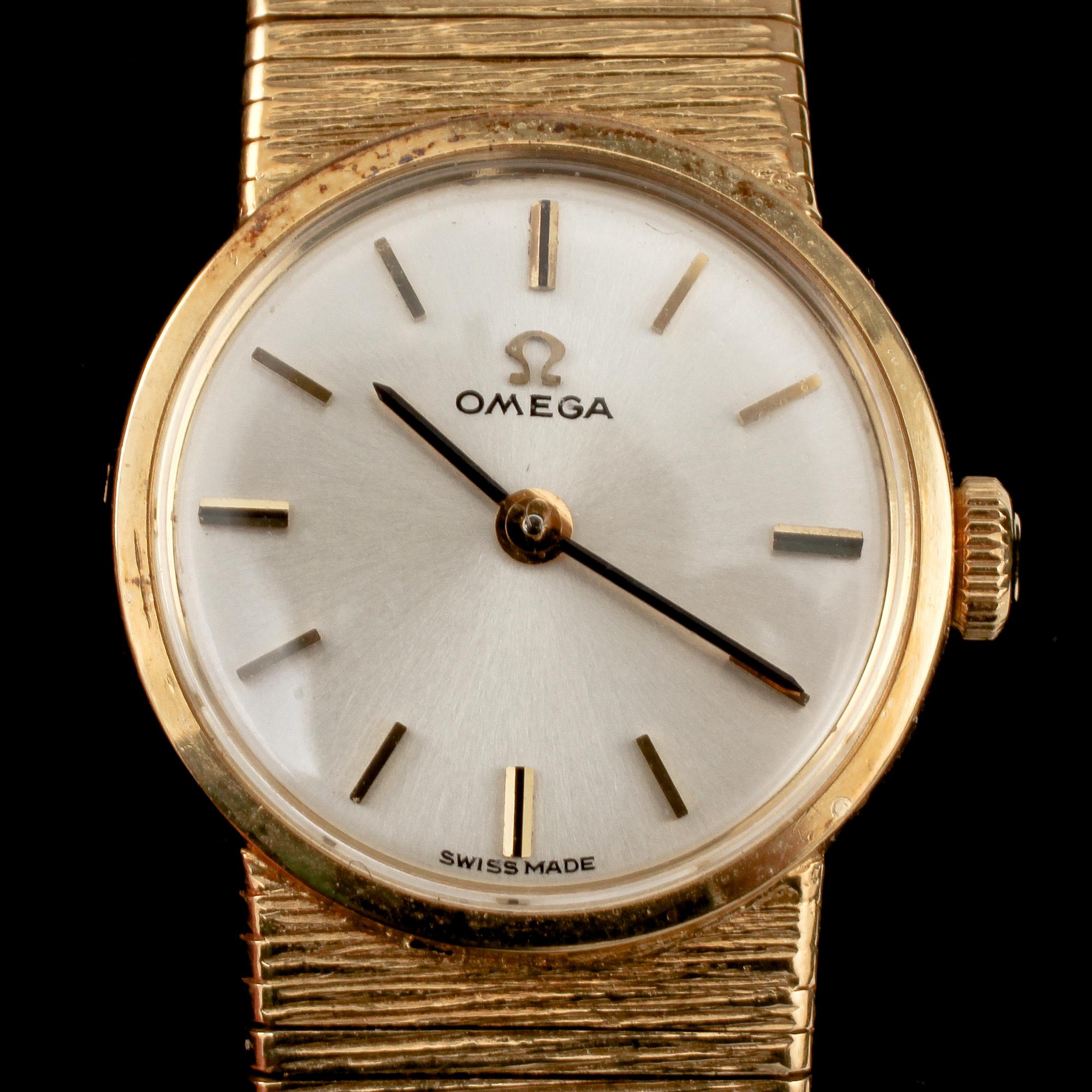 DAMARMBANDSUR, Omega, 18k guld, 1900-talets andra hälft. Vikt 39 g.