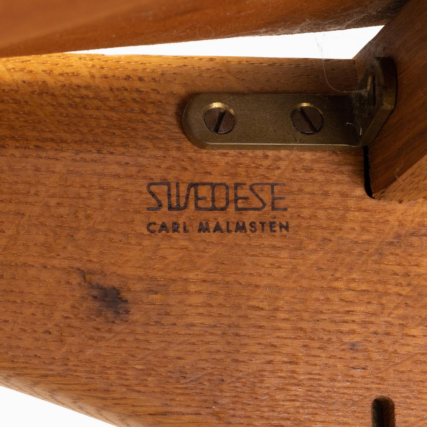 Carl Malmström & Yngve Ekström, a pair of 'Caryngo' oak armchairs, Swedese, second half of the 20th century.